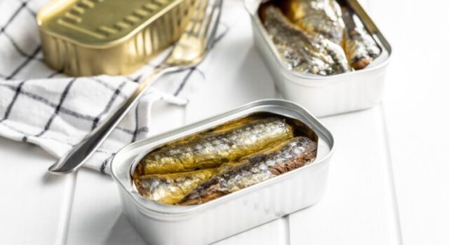 Canned,Sardines.,Sea,Fish,In,Tin,Can,On,White,Wooden